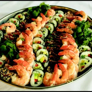 Seared ahi and scallops and California rolls with poached prawns