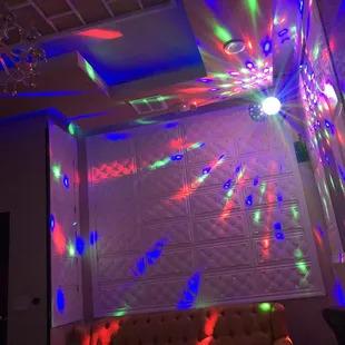 a room with a couch and a chandelier