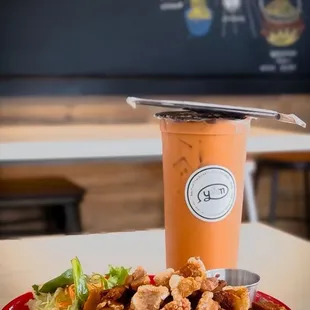 Lunch Pad See ew with crispy pork and Thai Ice Tea