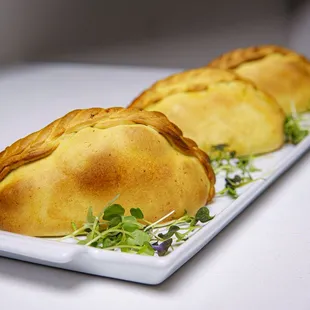 three pastries on a plate