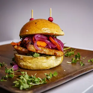 a burger with meat and vegetables