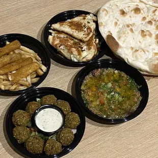 Mozzarella sticks, Falafel, Eggplant with Tomatoes and Cheese Arayes