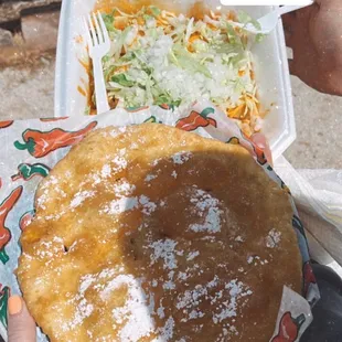 a person holding a plate of food