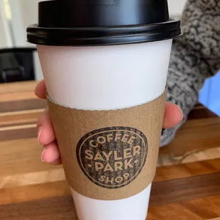 Whole milk latte ; hand modeling by Sophie