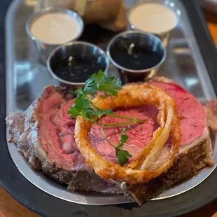 10 oz. Prime rib medium rare with baked potato.