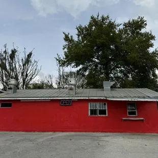 a red building with a metal roof