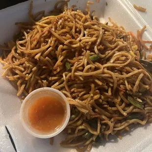 Vegetable chow mein with house-made hot pepper sauce on the side.