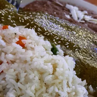 a plate of rice, beans, and beans