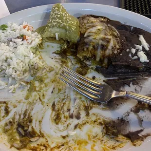 Carnitas enchiladas with pipian verde sauce and mole on the other. Both are amazing. Carnitas we're so flavorful!