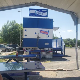 It's a food shack with outside seating and a nice breeze.