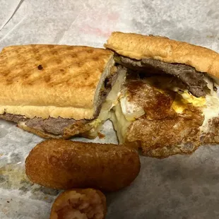 Steak, Egg, and Cheese Breakfast sandwich and Ham Croquettes