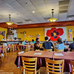 a large group of people sitting at tables
