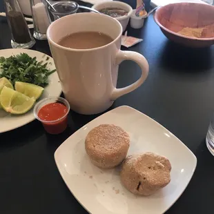 Coffee with a hint of cinnamon (southern Mexican style coffee) and bizcochos (traditional appetizer cookies similar to short bread cookies)