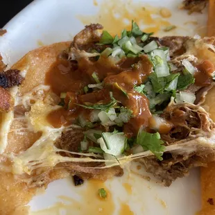 I pried my tacos apart and added some onions and cilantro and hot sauce