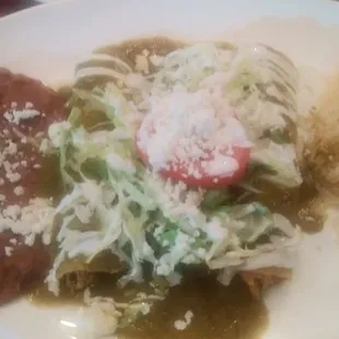 Delicious green chicken enchiladas, authentic Mexican food.