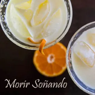 a close up of two glasses of lemonade