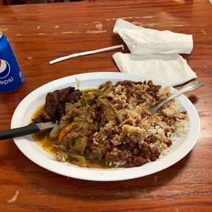 a plate of food with rice and beans