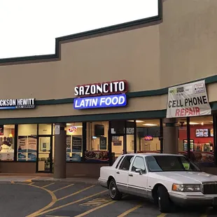 a car parked in front of a restaurant