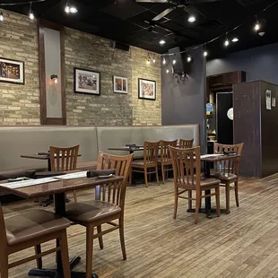 a dining area with tables and chairs