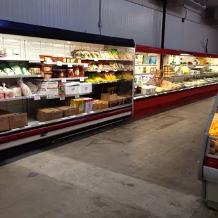 a car parked in front of a refrigerated produce section