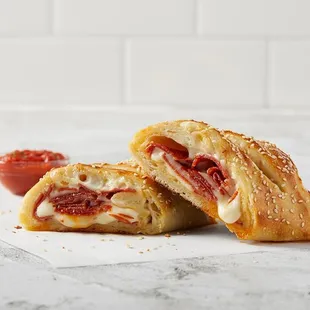 a close up of a pastry with a bite taken out of it