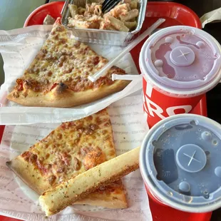 a tray of pizza and fries