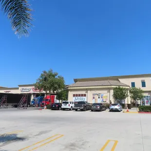 a parking lot in front of a commercial building