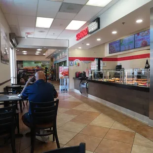 a man sitting at a table in a restaurant