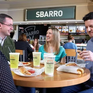 a group of people sitting at a table