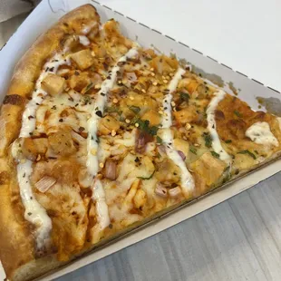 Buffalo chicken pizza slice.