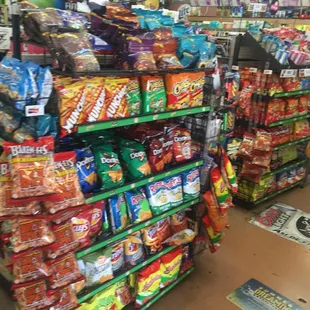 2 different rows of chips and other snacks