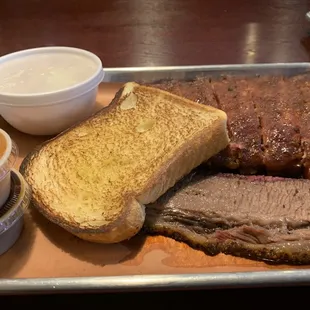 Brisket, House sausage, half rack, spicy slaw. All meats tender, flavorful, and stellar quality.