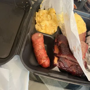Rib and brisket dinner: 1/4 a pound of brisket, three ribs, mac &amp; cheese, 1/2 hot link, cornbread.