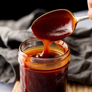  spoon full of bbq sauce