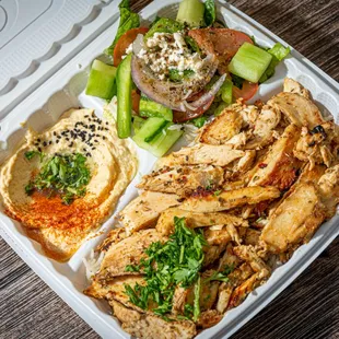 a chicken sandwich and a salad