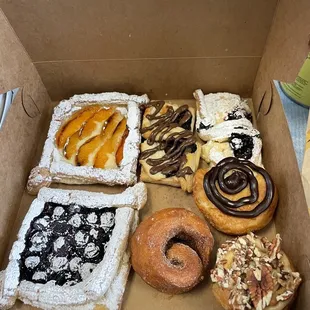 a variety of pastries in a box