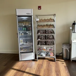 a refrigerator and shelves of food