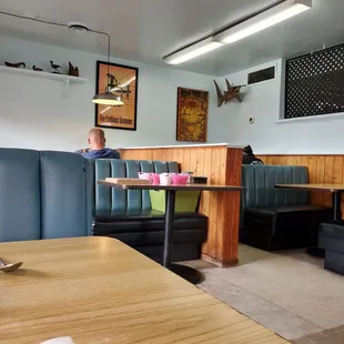 a man sitting at a table in a restaurant