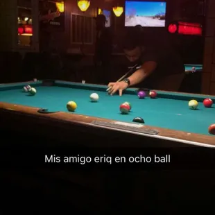 a man playing pool