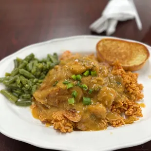Étouffée with shrimp and catfish over jambalaya rice