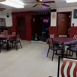 Kareoke set up. Plenty of space between dining tables throughout cafe.