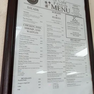 Menu hanging in wall as you come in.