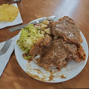 Pork chops, cabbage, and potatoes.