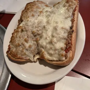 a piece of pizza on a plate