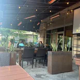 outdoor dining area with tables and chairs