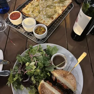 a plate of food and a bottle of wine