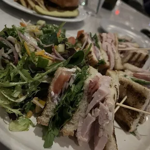 Huge and yummy turkey club with an enormous and great side salad
