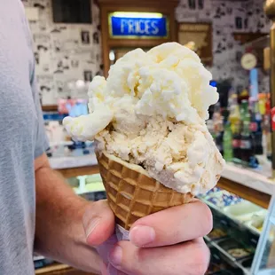 a man holding a cone of ice cream