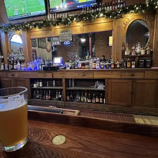 a pint of beer on the bar