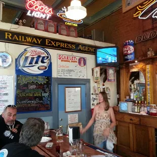 a group of people sitting at a bar